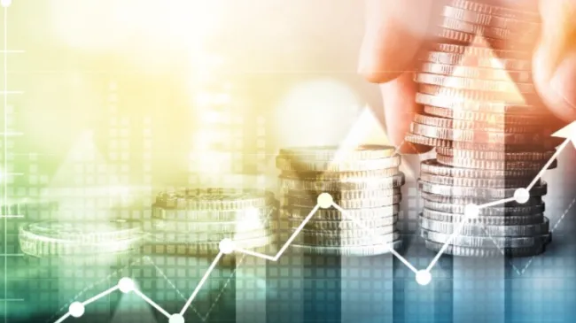 stacks of coins with positive line graph
